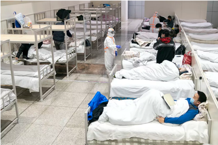 Coronavirus patients await treatment at a hospital